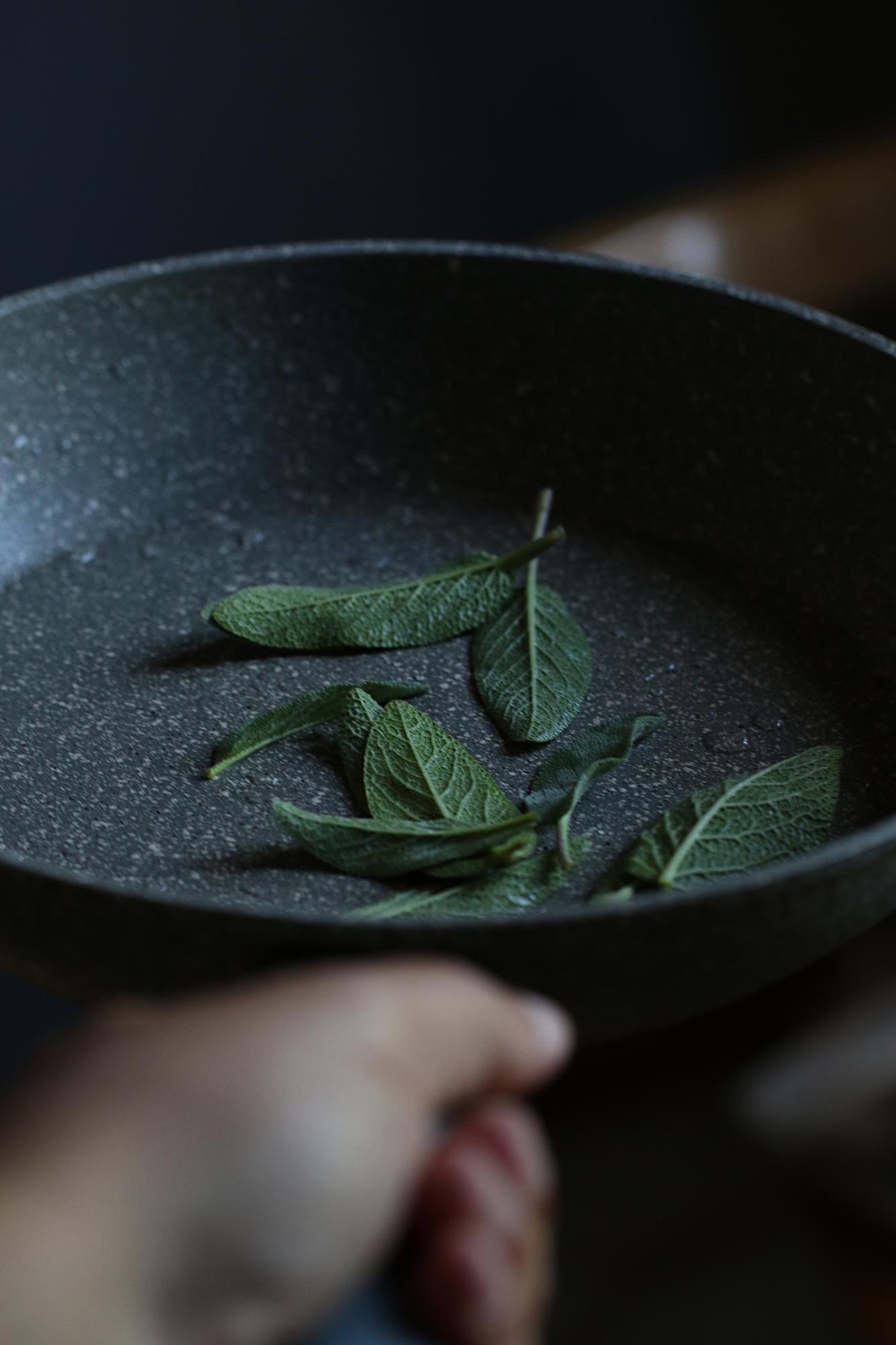 Hand-crafted plated dish with herbs on dark table